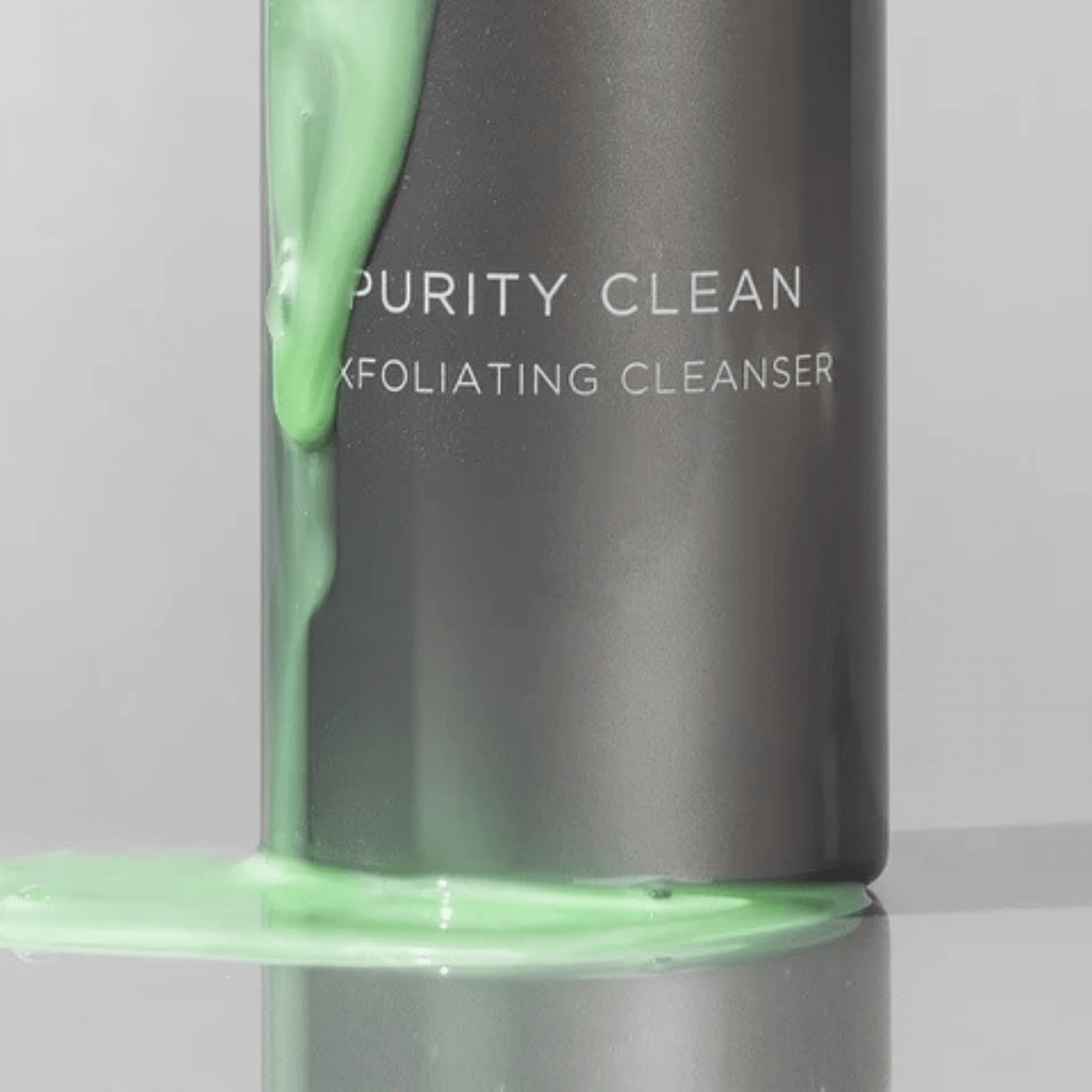 Aspect Dr Purity Clean with green cleanser dripping on a grey background