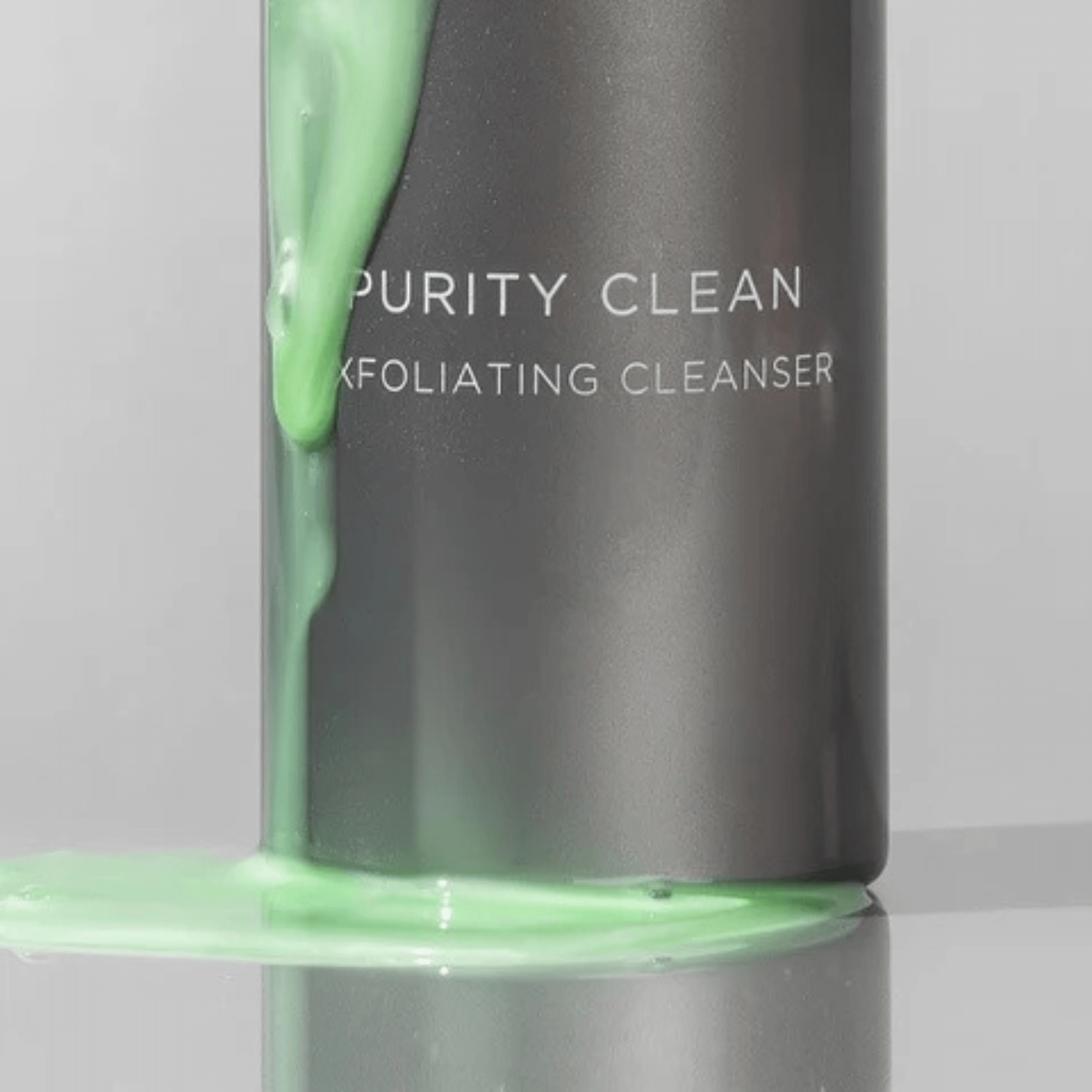 Aspect Dr Purity Clean with green cleanser dripping on a grey background