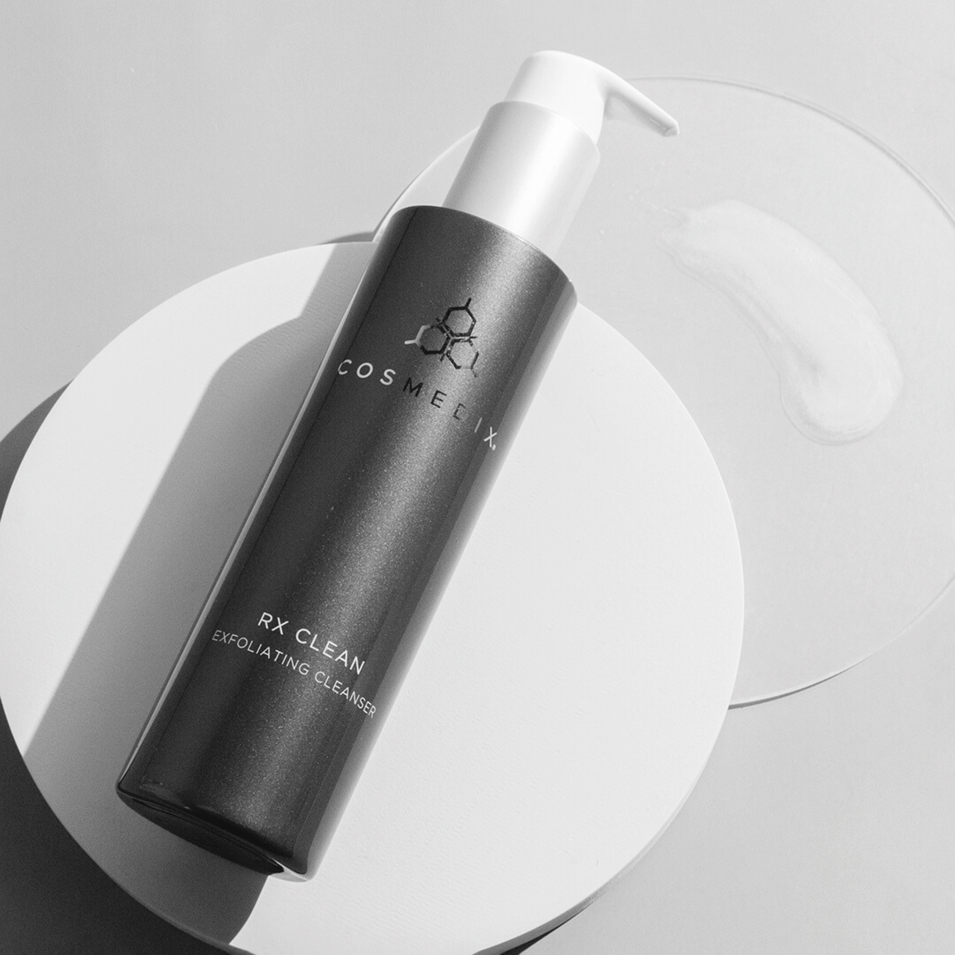 COSMEDIX ELITE Exfoliating Cleanser on a light a grey background
