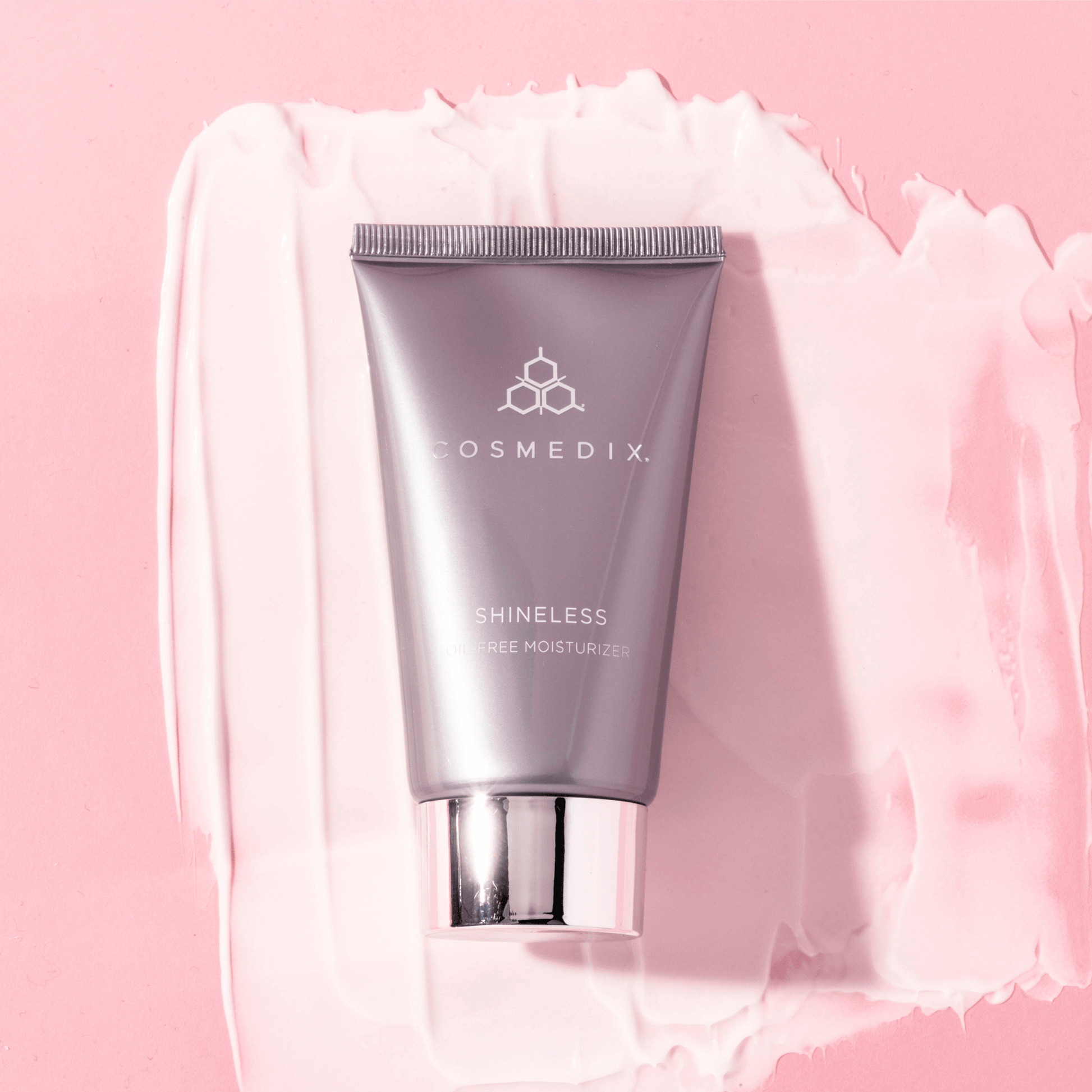 Cosmedix Shineless moisturiser on pink background