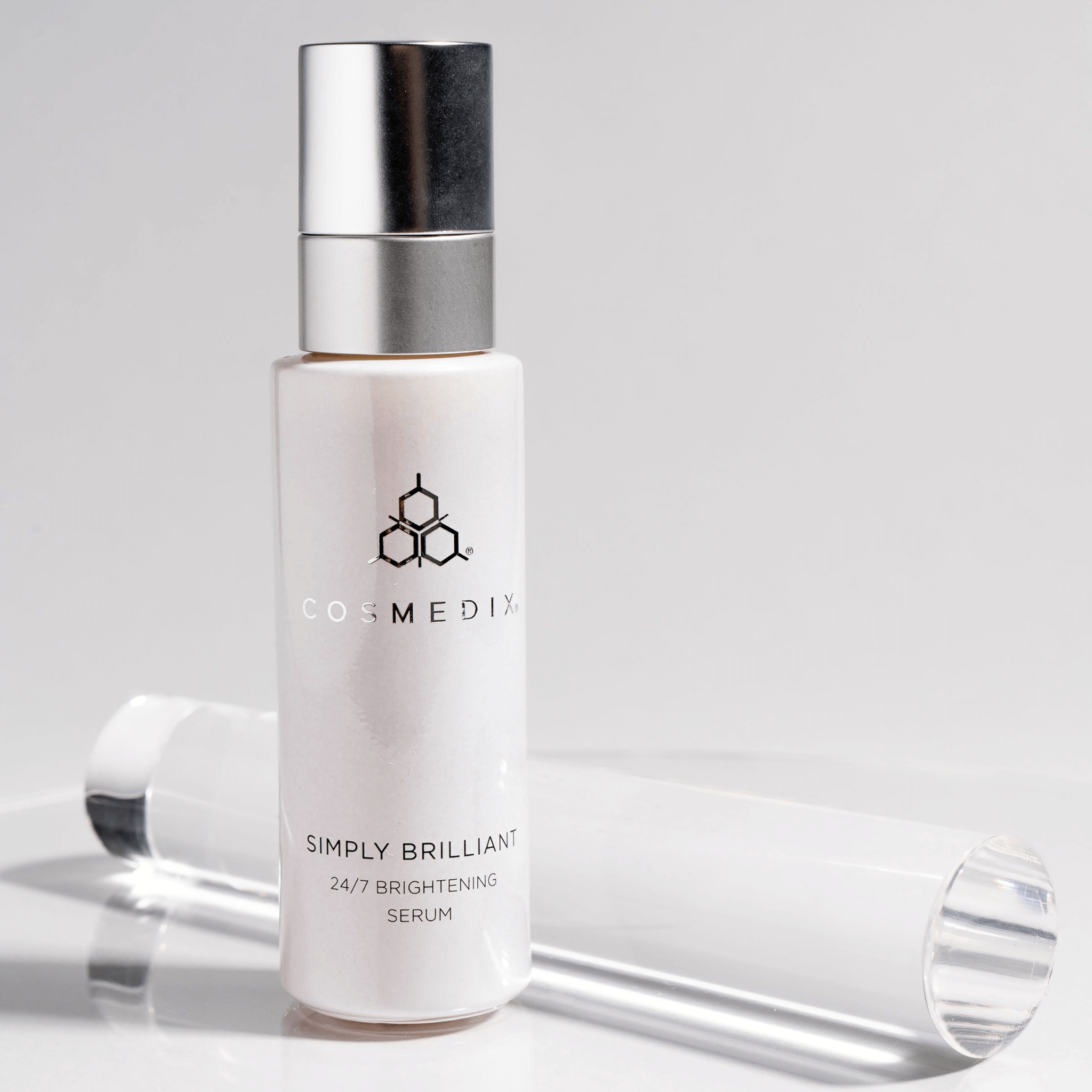 Cosmedix Simply Brilliant serum bottle on a light grey background