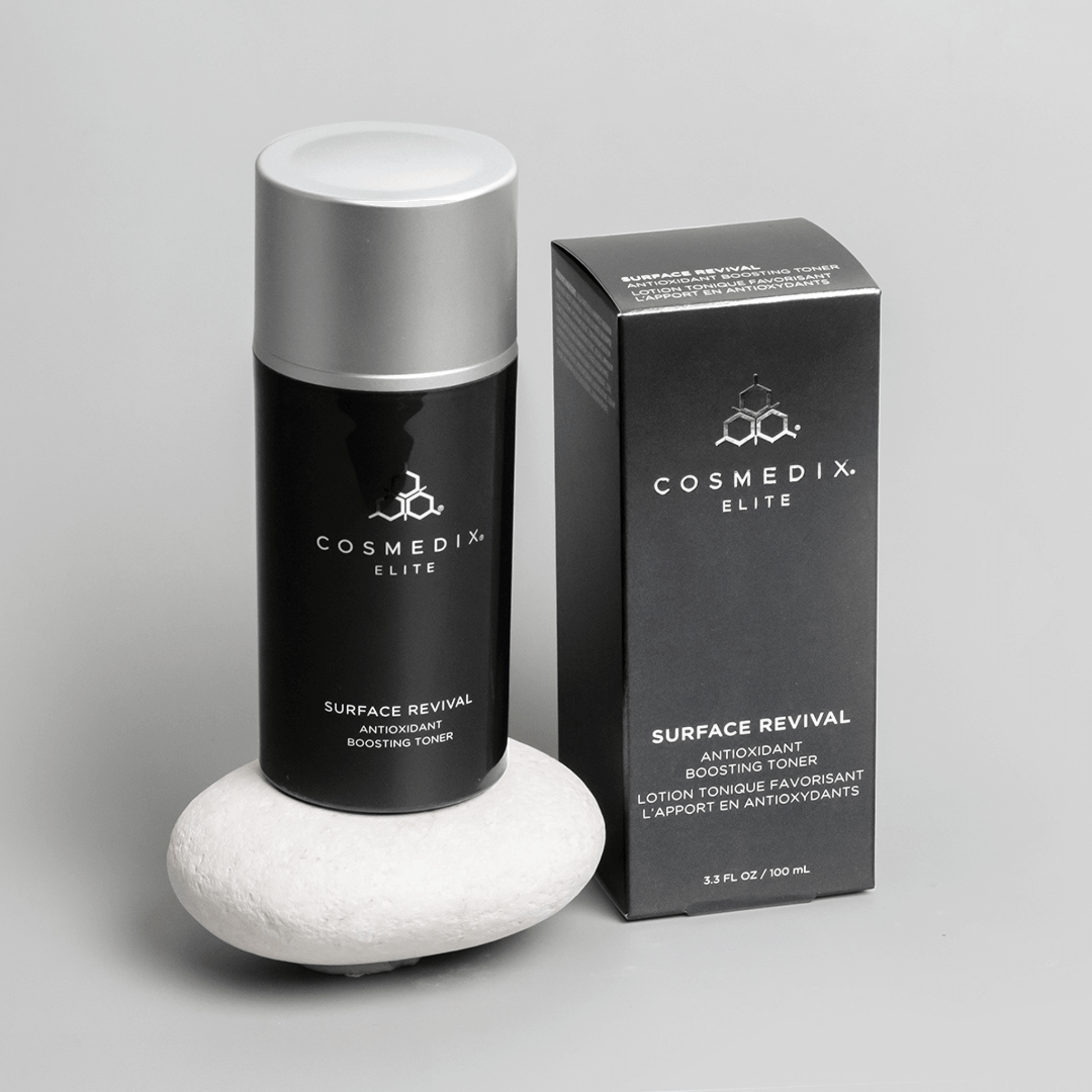 Cosmedix Surface Revival toner bottle and packaging on a grey background