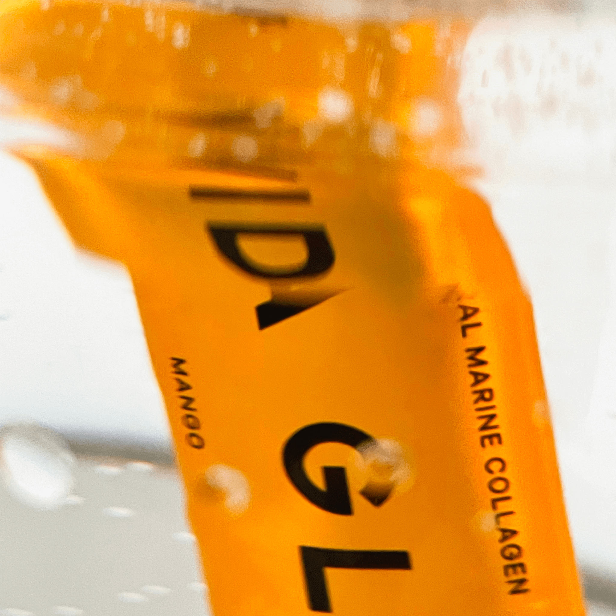 Vida Glow Mango flavour powder sachet close up