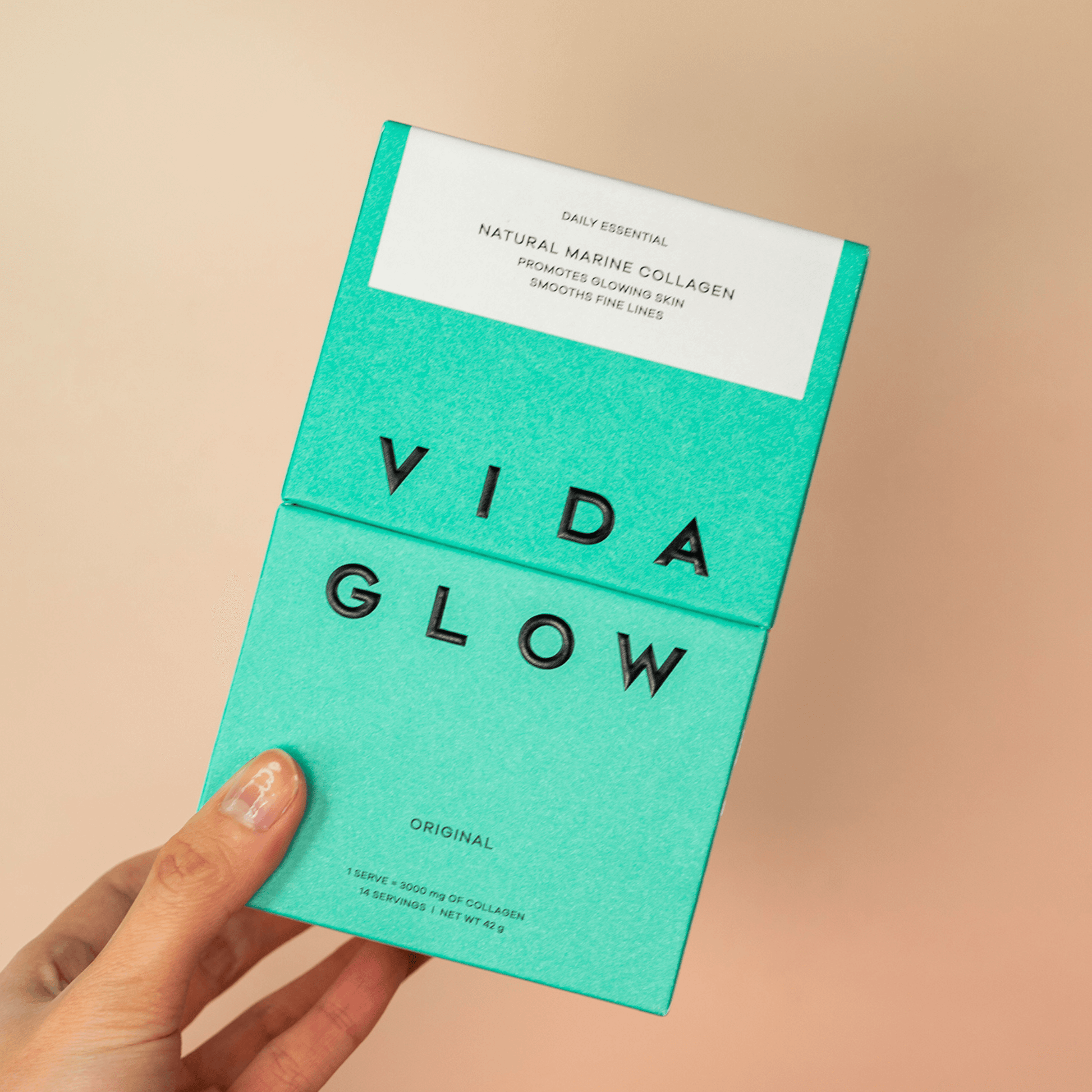Vida Glow original trial box front ogf package handheld by model