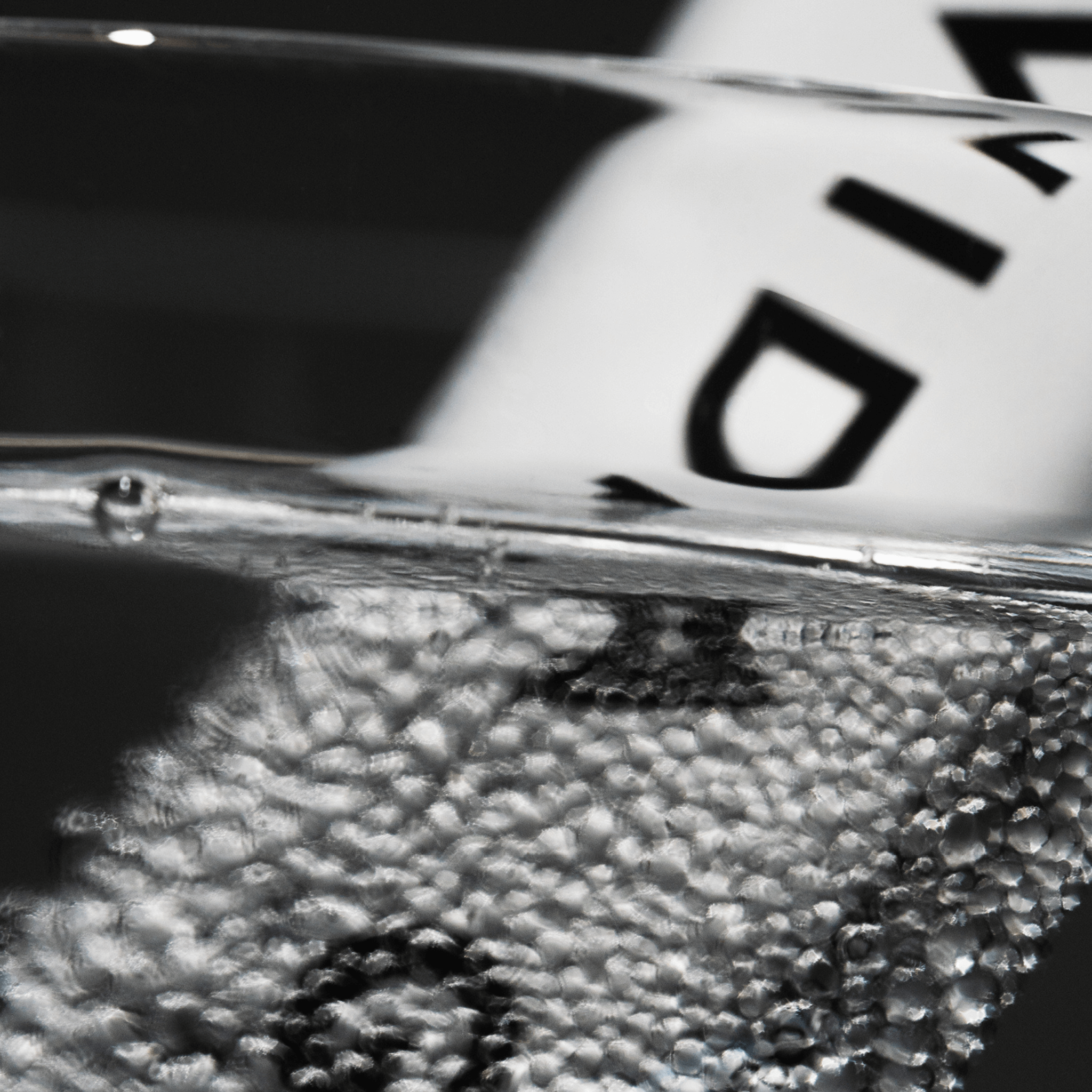 Vida Glow pro collagen+ sachet sitting in effervescent water