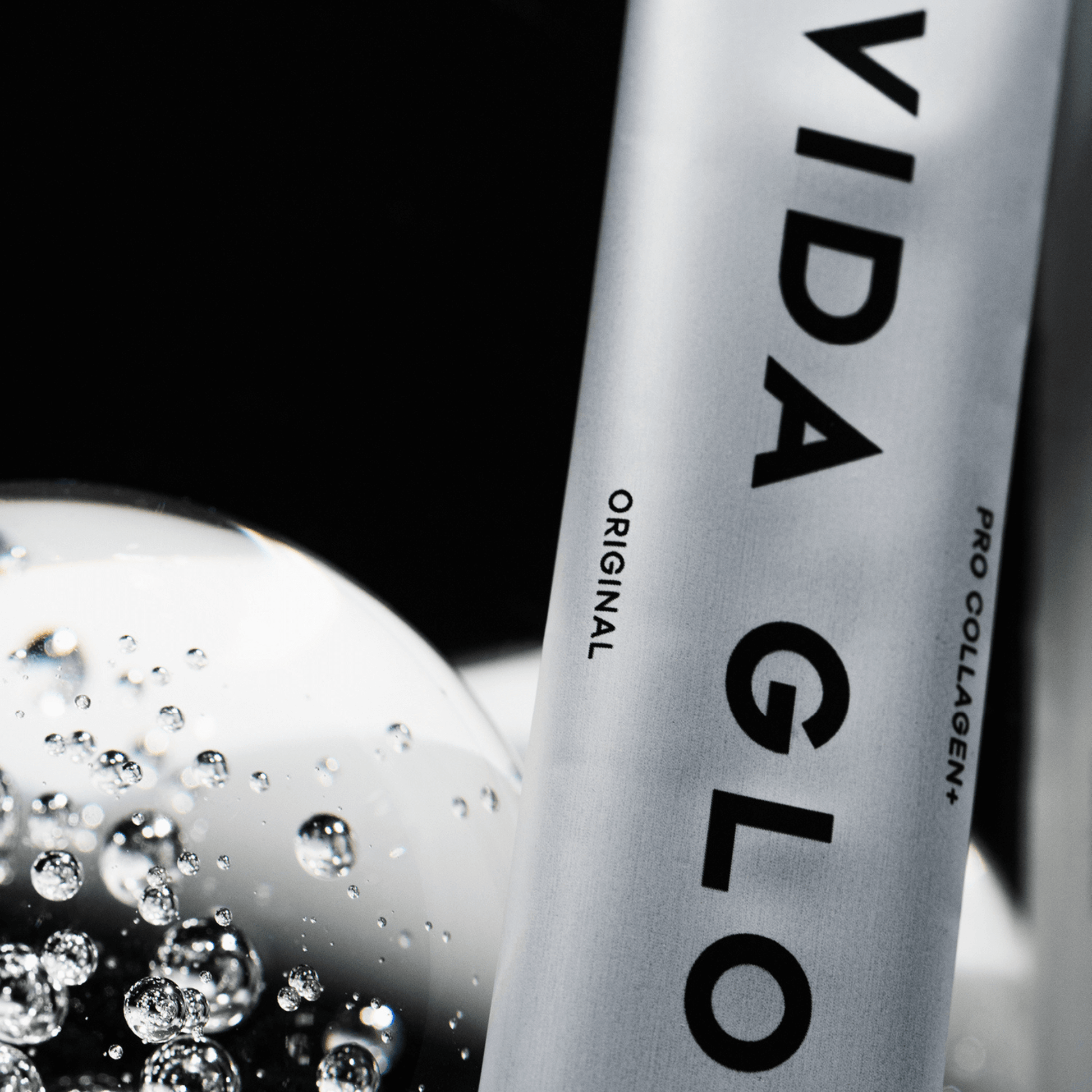 Vida glow pro collagen plus up close sachet on black background