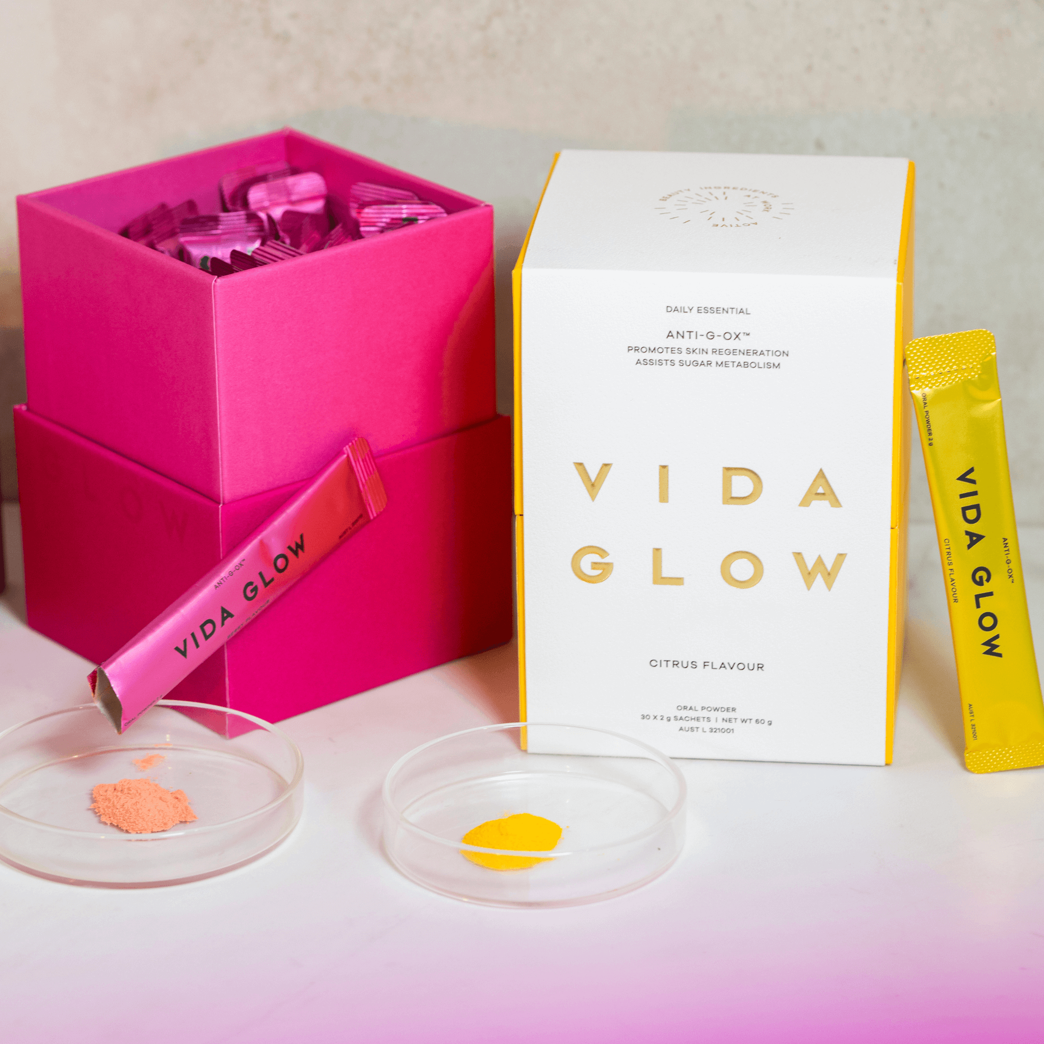 Vida glow anti-g-ox dual flavour packs citrus and berry flavour with sachets and petri dishes of collagen powder